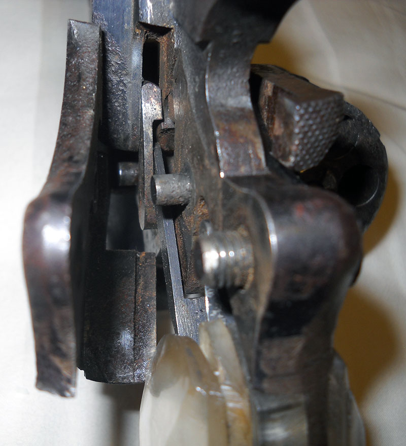 closeup on partly open side plate of 1892 French Ordnance Revolver